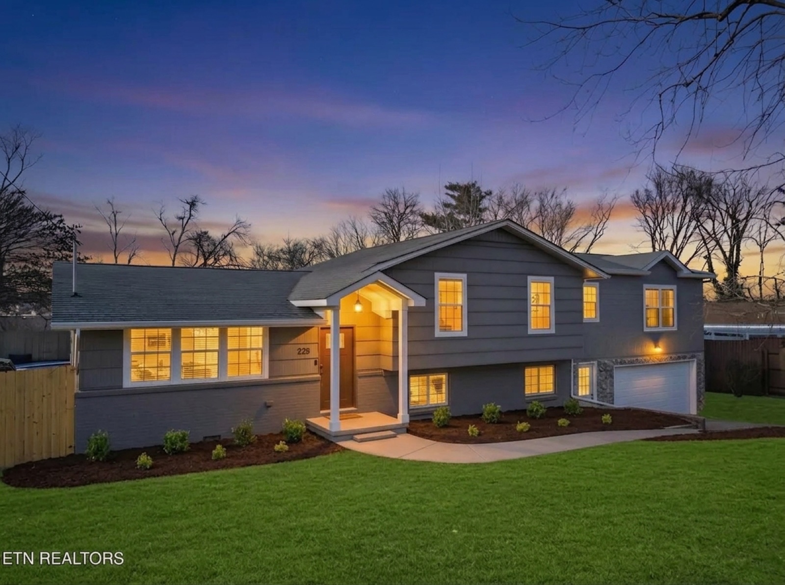 Two-story front exterior at dusk — after unstaging